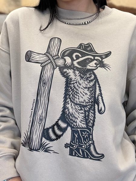 The Cowboy Raccoon Cross Mocha Sweatshirt