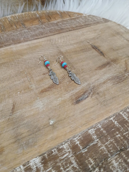 The Real Time Feather Earrings