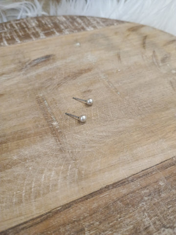 The Tiny Silver Stud Earrings