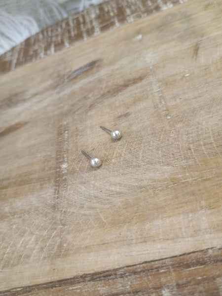 The Tiny Silver Stud Earrings