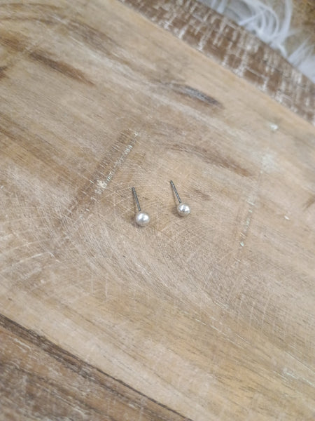 The Tiny Silver Stud Earrings