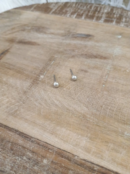The Tiny Silver Stud Earrings